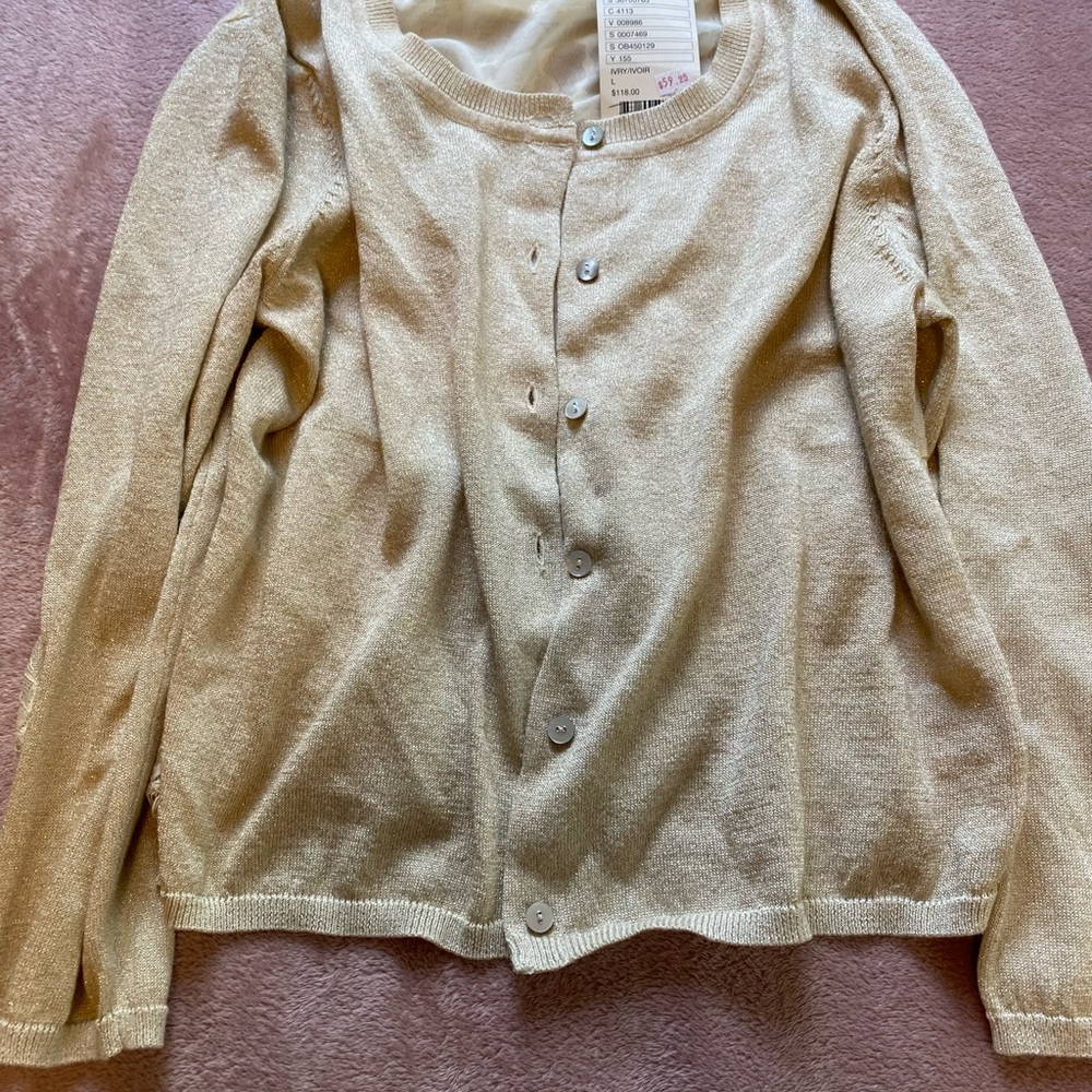 Feminine Anthropologie sweater size large petite, slightly cropped.